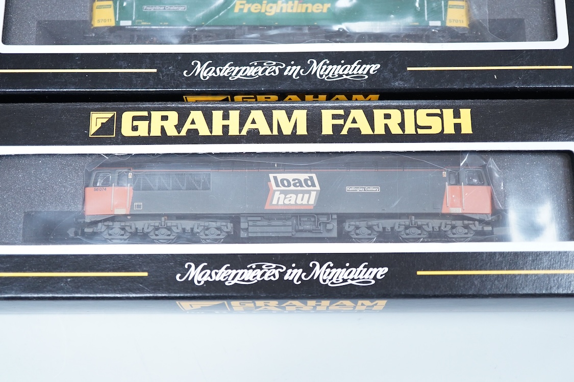 Three boxed Graham Farish N gauge railway diesel locomotives; an EWS class 56, 56105 (371300), a Load Haul class 56, Kellingley Colliery 56 074 (371301), and a Freightliner class 57, Freightliner Challenger 57011, (37122